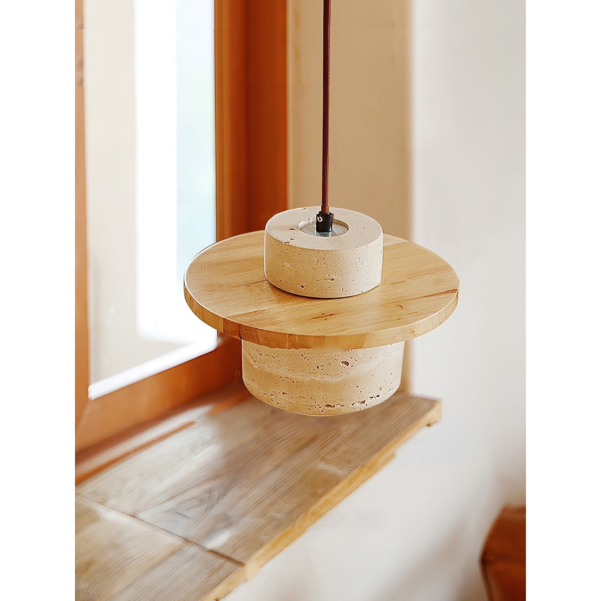 The Stonova Duo Pendant Lamp illuminated, casting a warm and inviting glow.