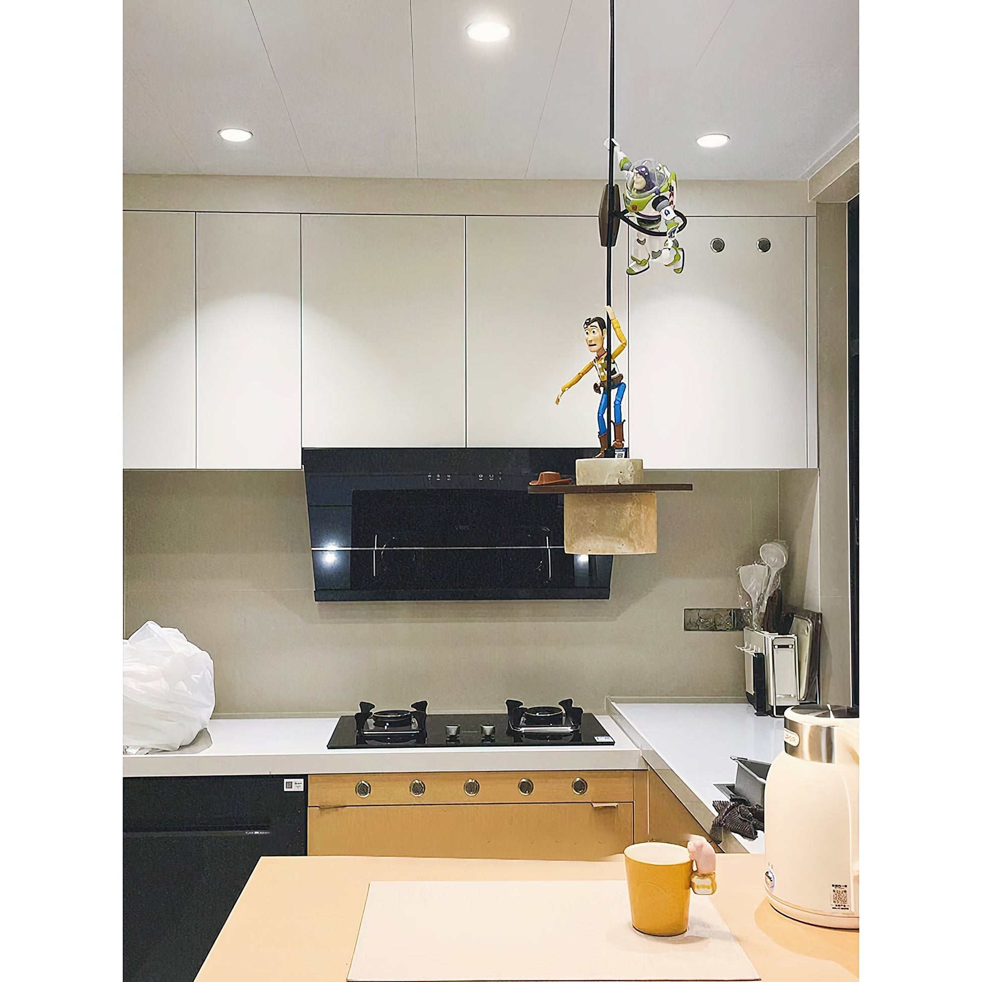 Lifestyle view of the pendant lamp installed above a kitchen island.