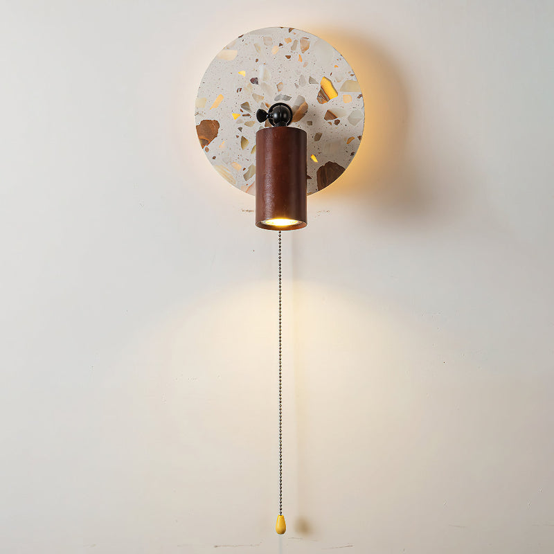 The lamp's beige and amber tones highlighted by the integrated LED light.