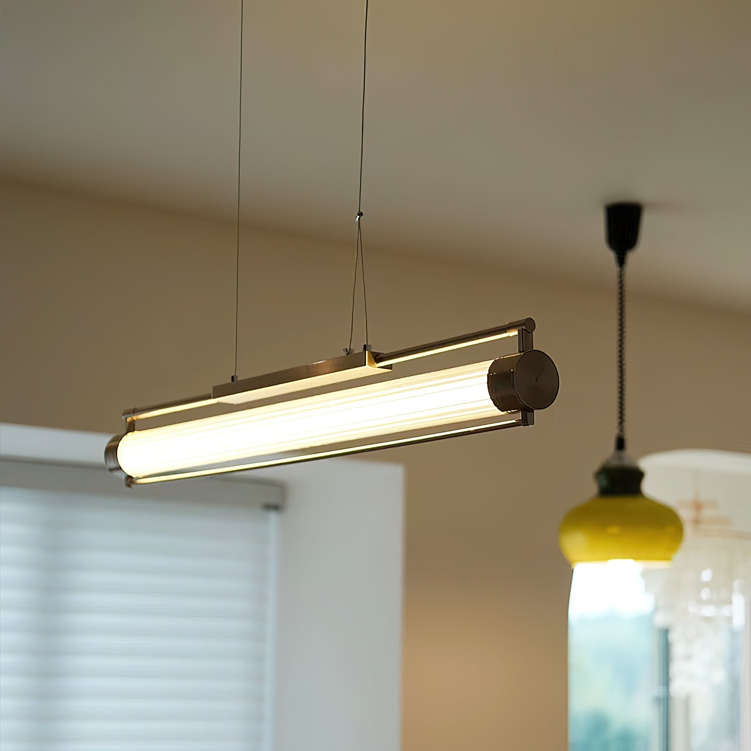 Close-up of the Tamar Wand Pendant Lamp's textured glass shade.