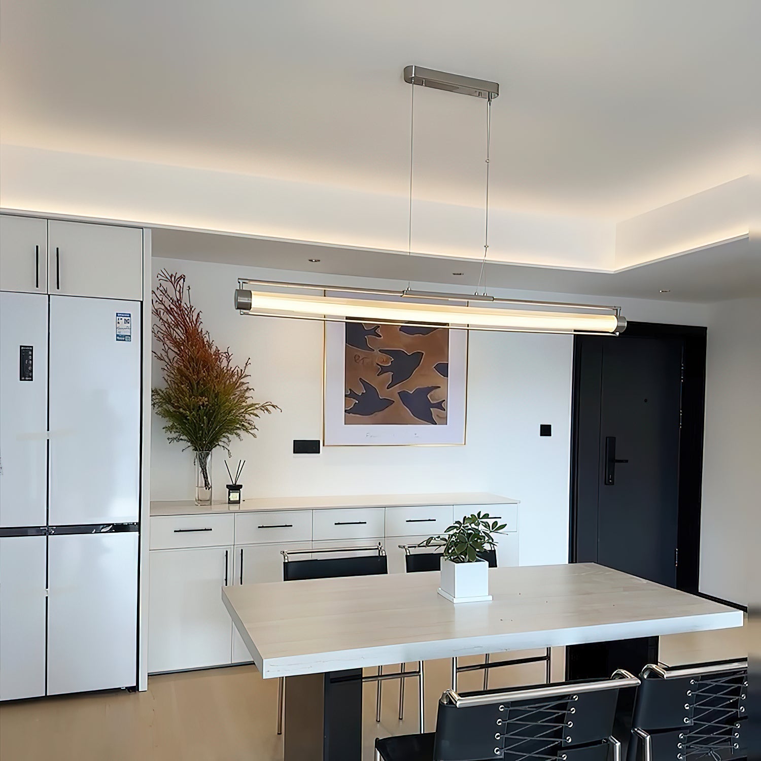 The Tamar Wand Pendant Lamp shown in a contemporary living room setting.