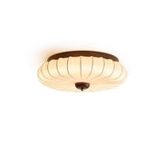 Tate Walnut Flush Mount with ribbed fabric shade.
