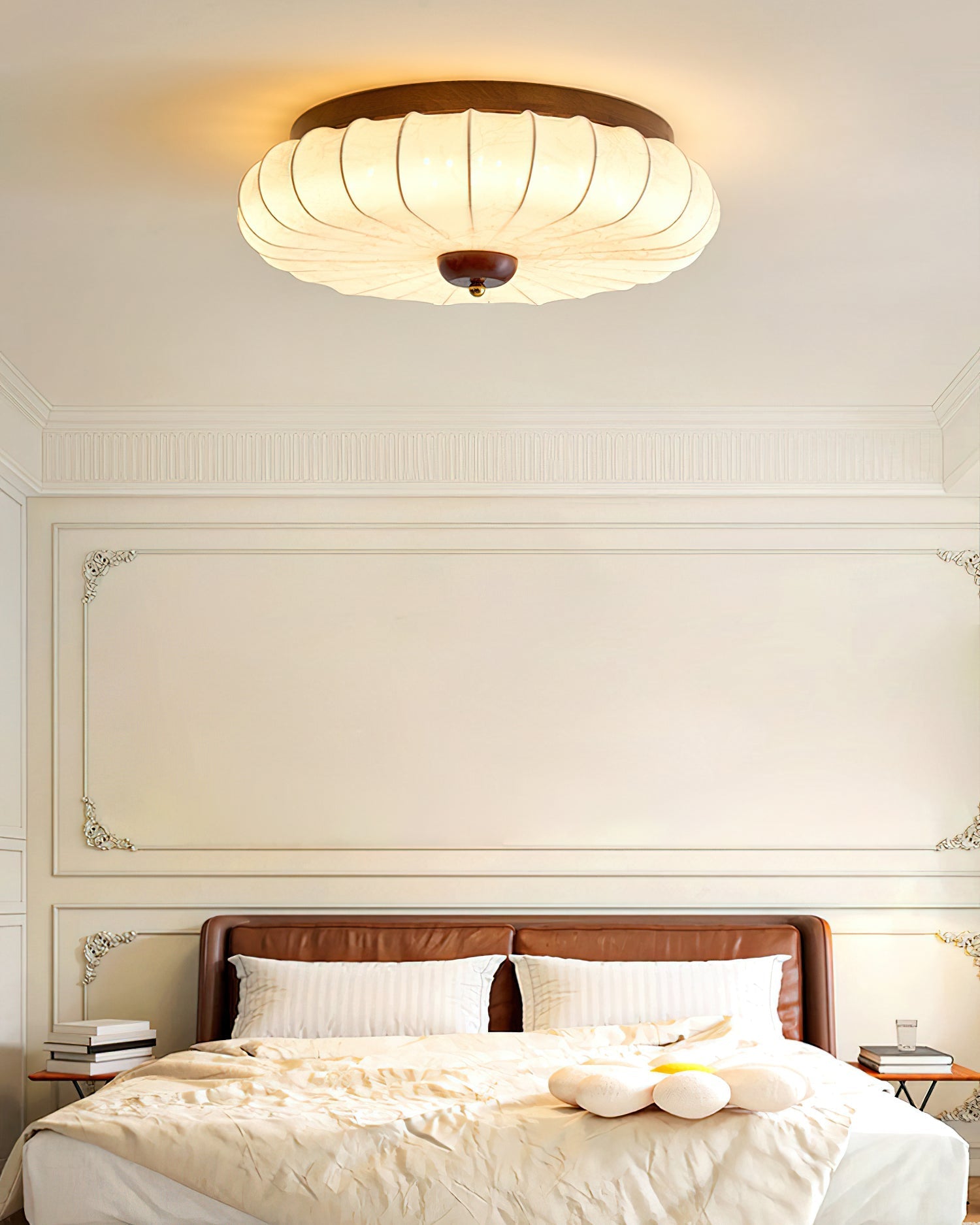 The light fixture against a white ceiling.
