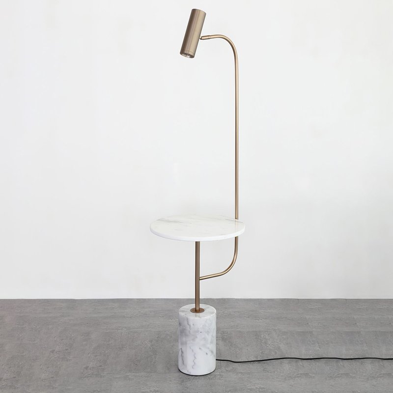 Lifestyle image showing the lamp illuminating a cozy corner.