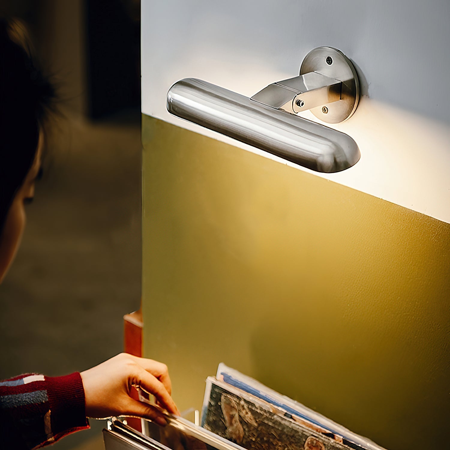 Teetoo Wall Lamp shown illuminated in a dark room.