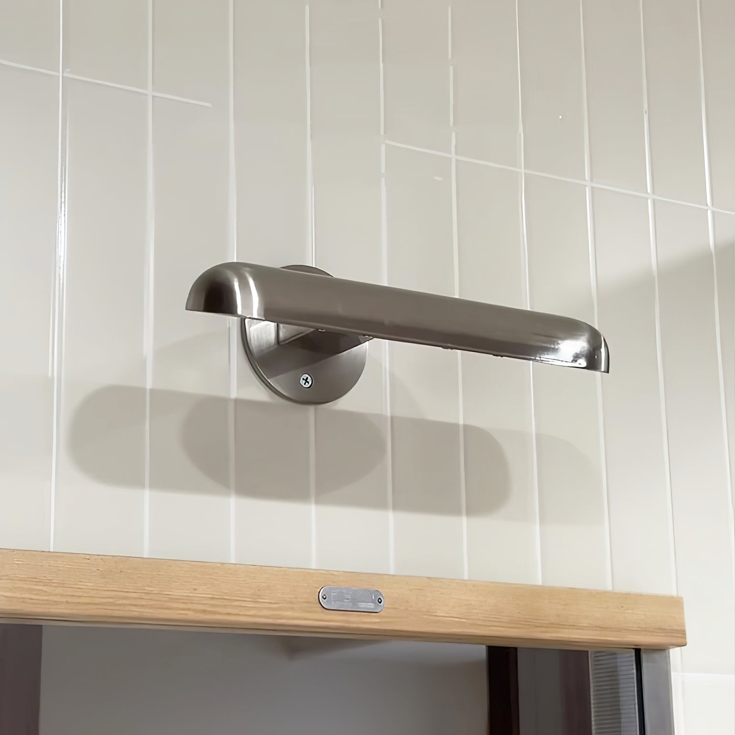 Lifestyle image of the Teetoo Wall Lamp in a modern living room.