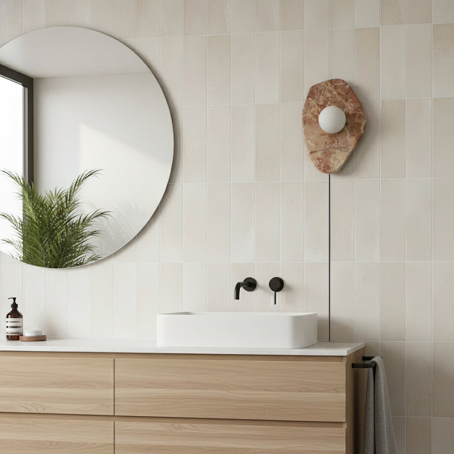 Side view of the pink marble wall lamp showing its profile and dimensions.
