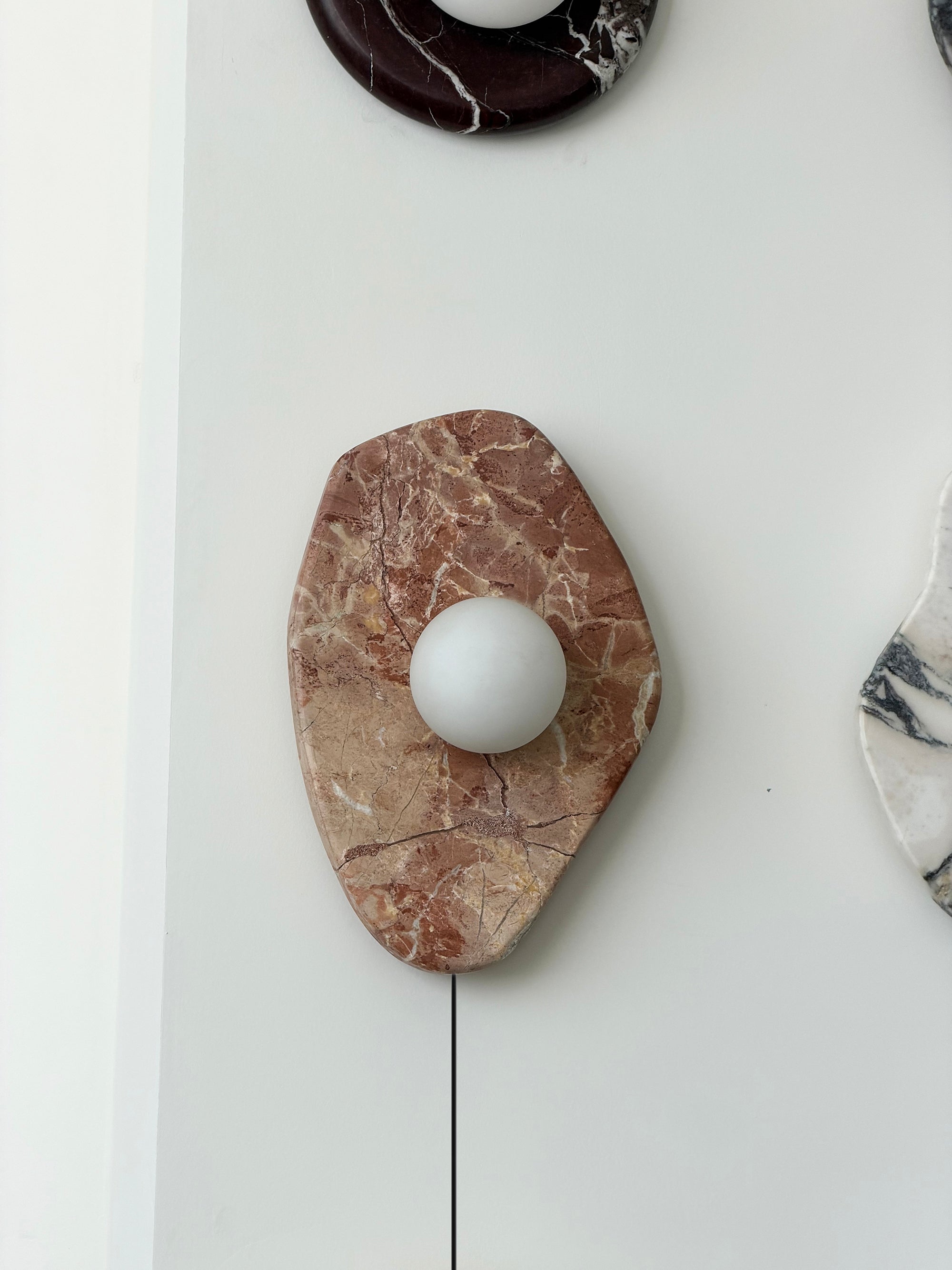 The wall lamp styled in a contemporary living room setting.
