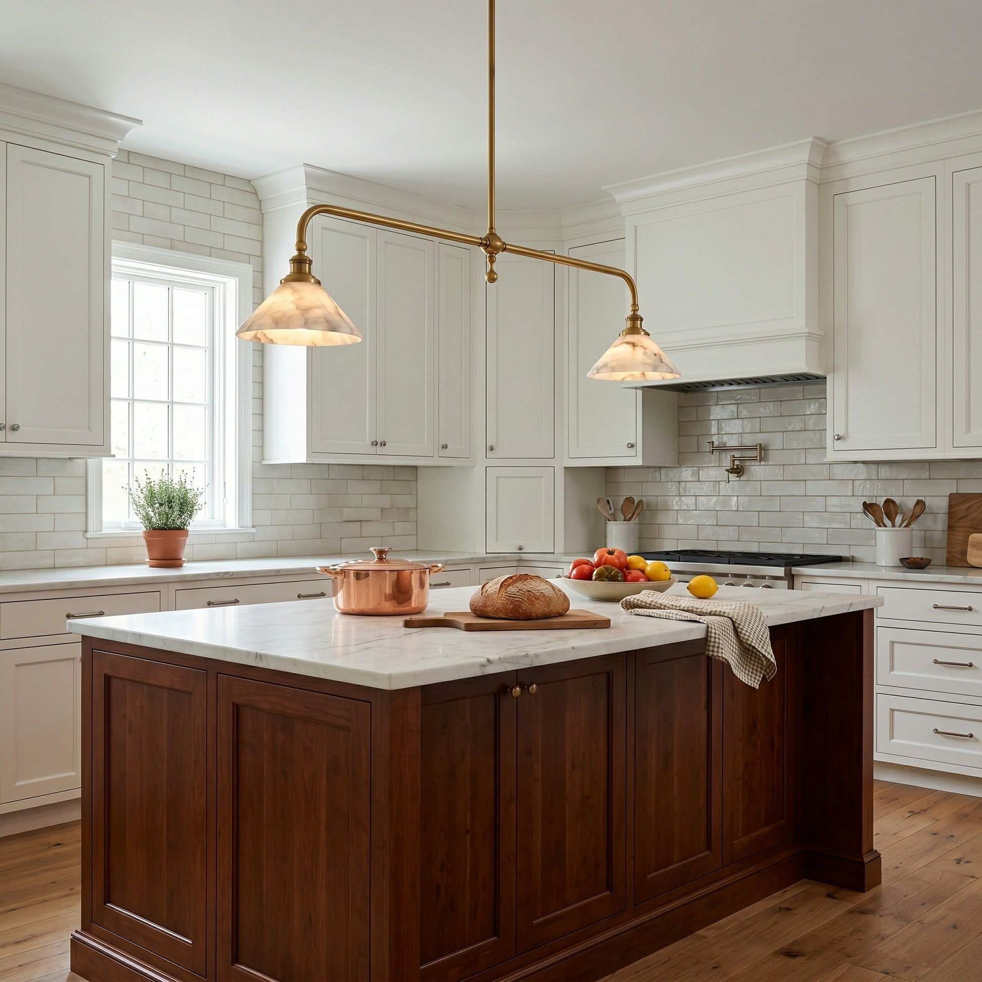 Angled shot of the dual-shade alabaster and brass pendant light.