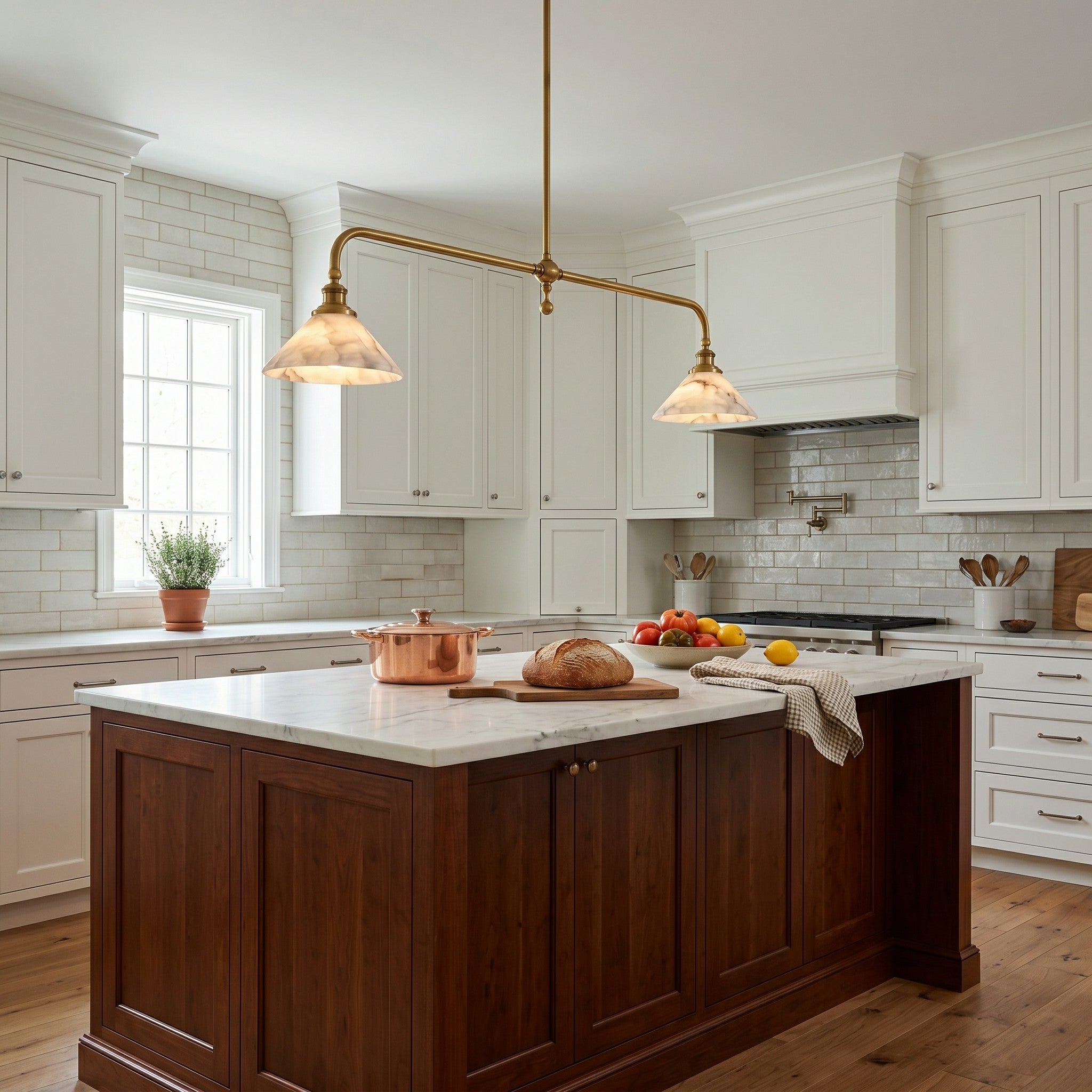 Angled shot of the dual-shade alabaster and brass pendant light.