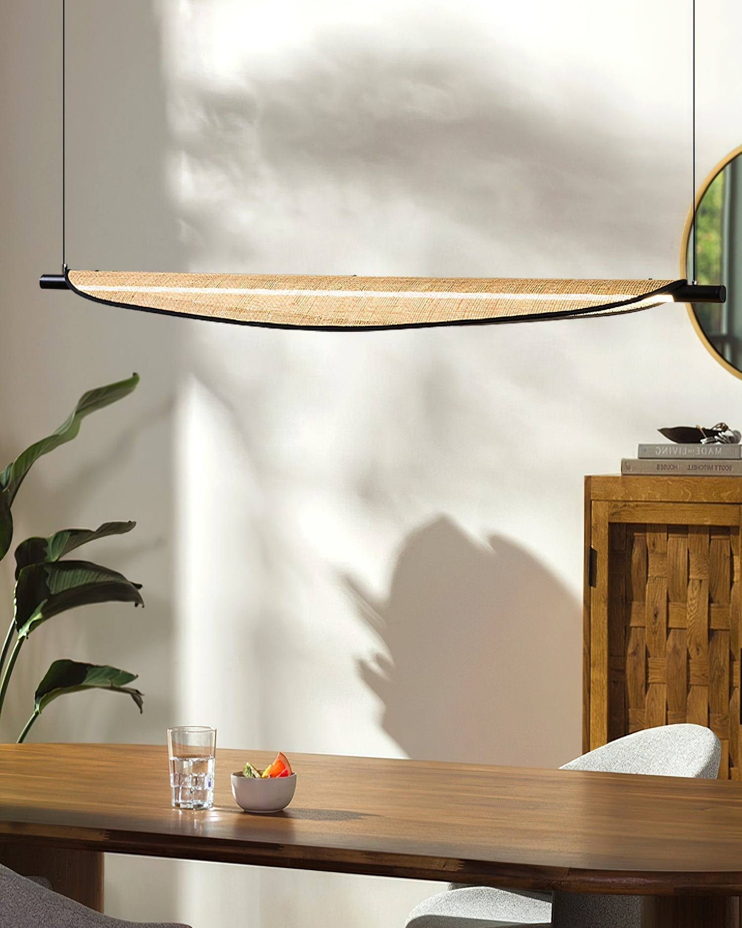 Side profile of the Thula Linear Chandelier showcasing its elongated form.