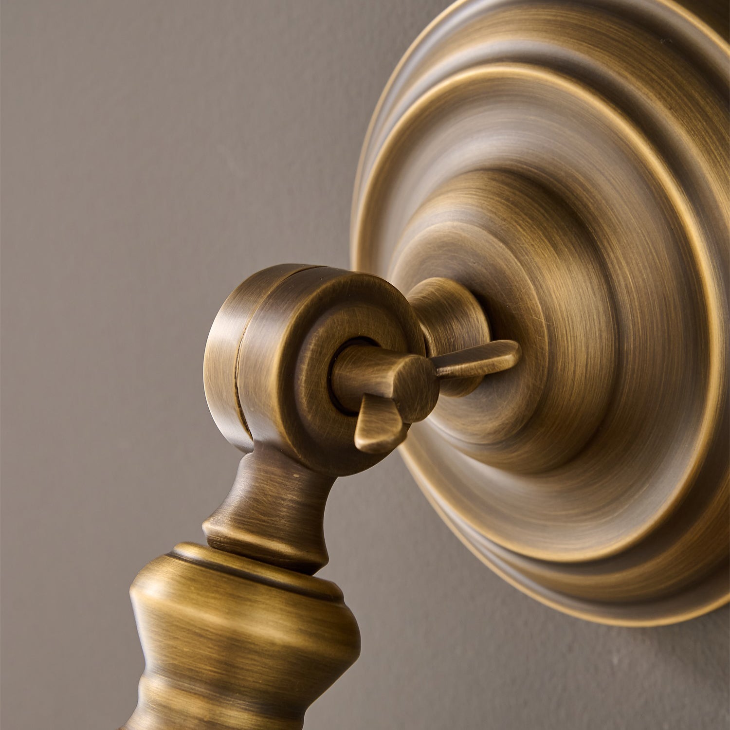 Close-up of the antique brass finish under bright light.