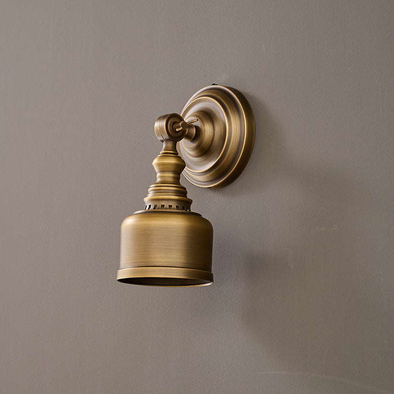 The antique brass finish complementing an oak wood background.