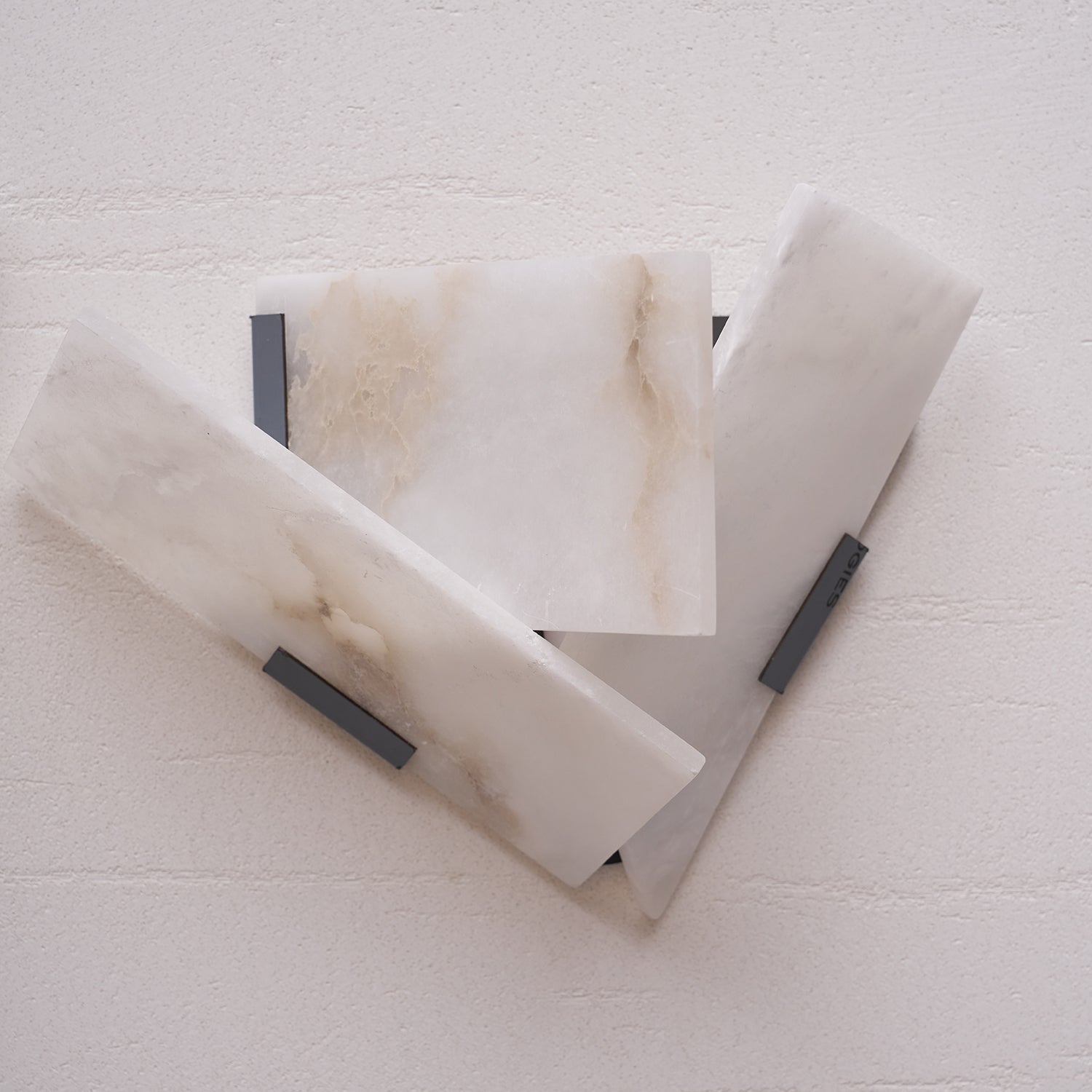 Side profile of a cantilevered alabaster sconce.