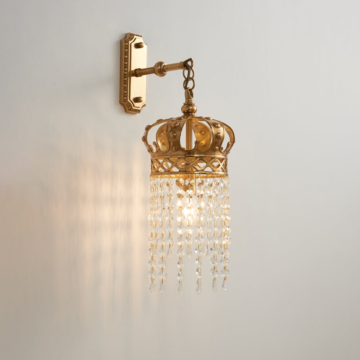 The lamp casting elegant light patterns on the wall.