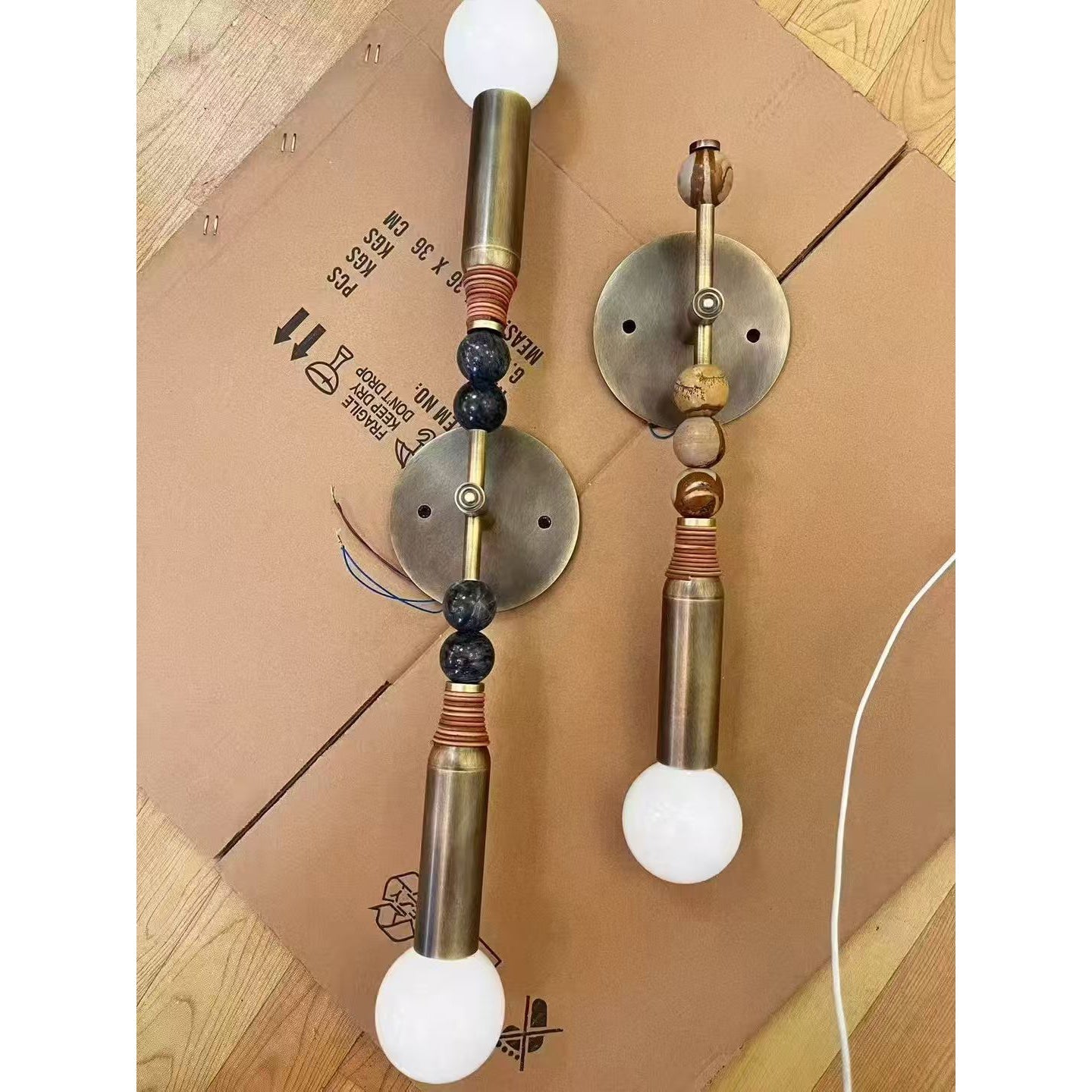 Toam Double Wall Lamp, brown finish, detail shot.