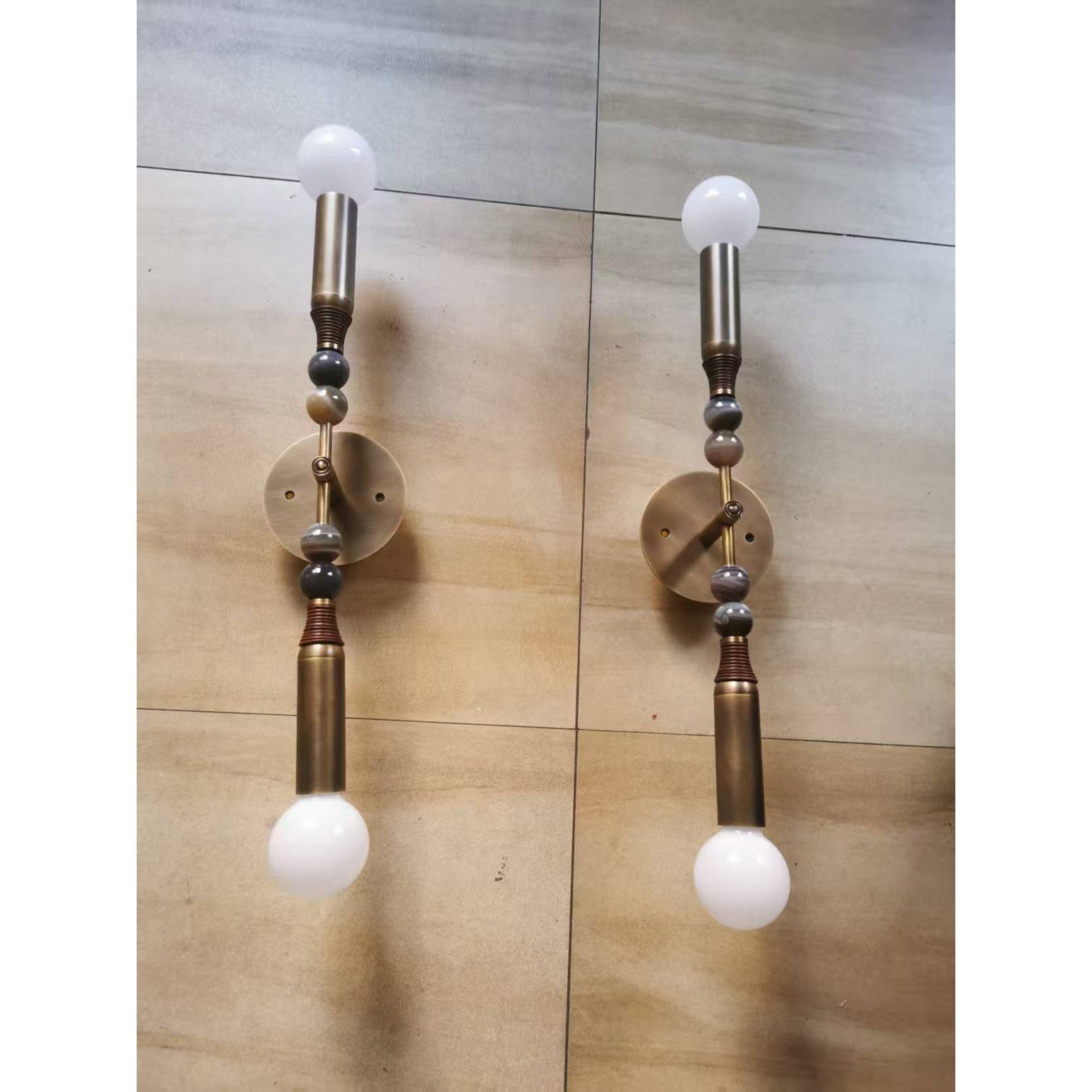 Toam Double Wall Lamp in a bedroom setting.