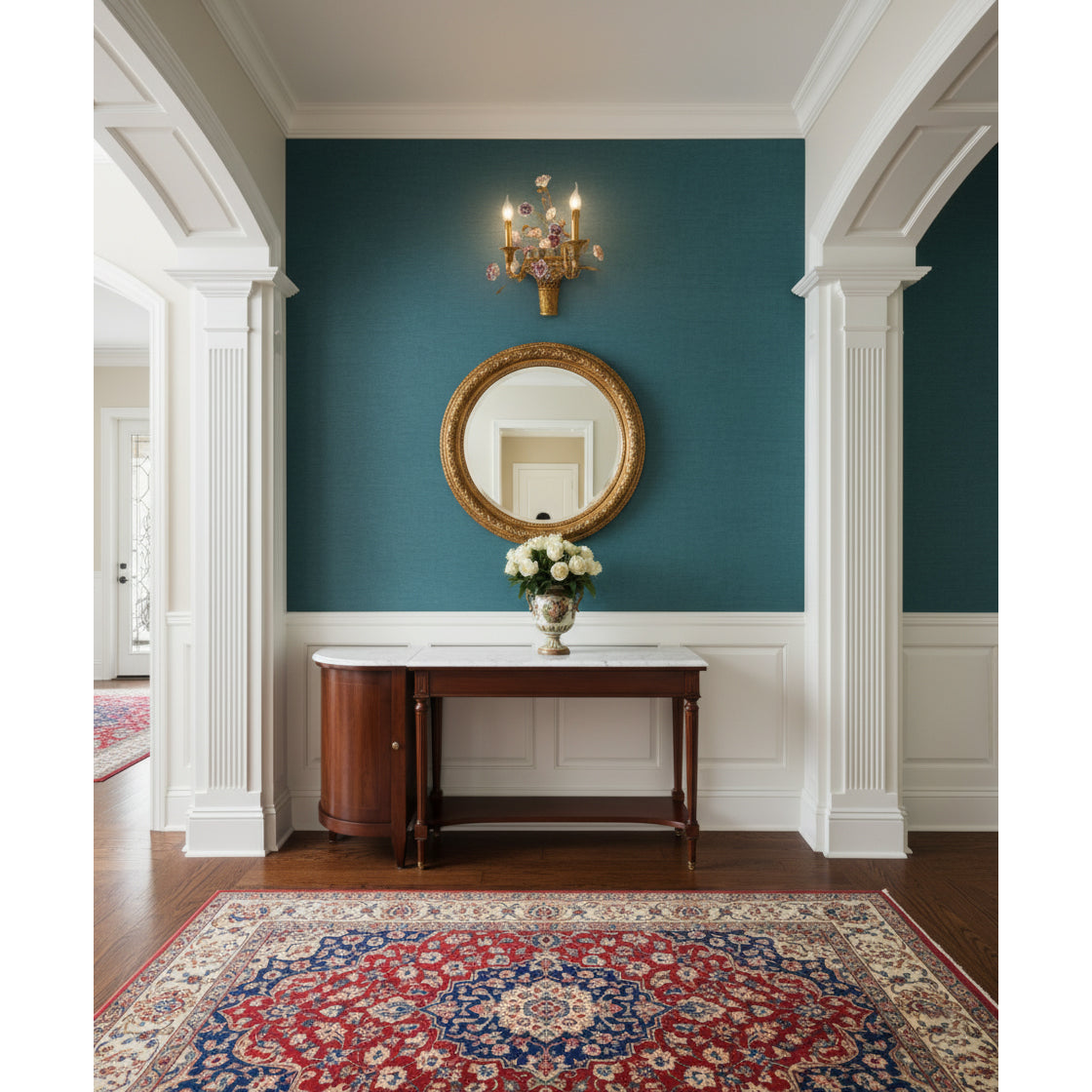 The Tole wall lamp illuminating a hallway.