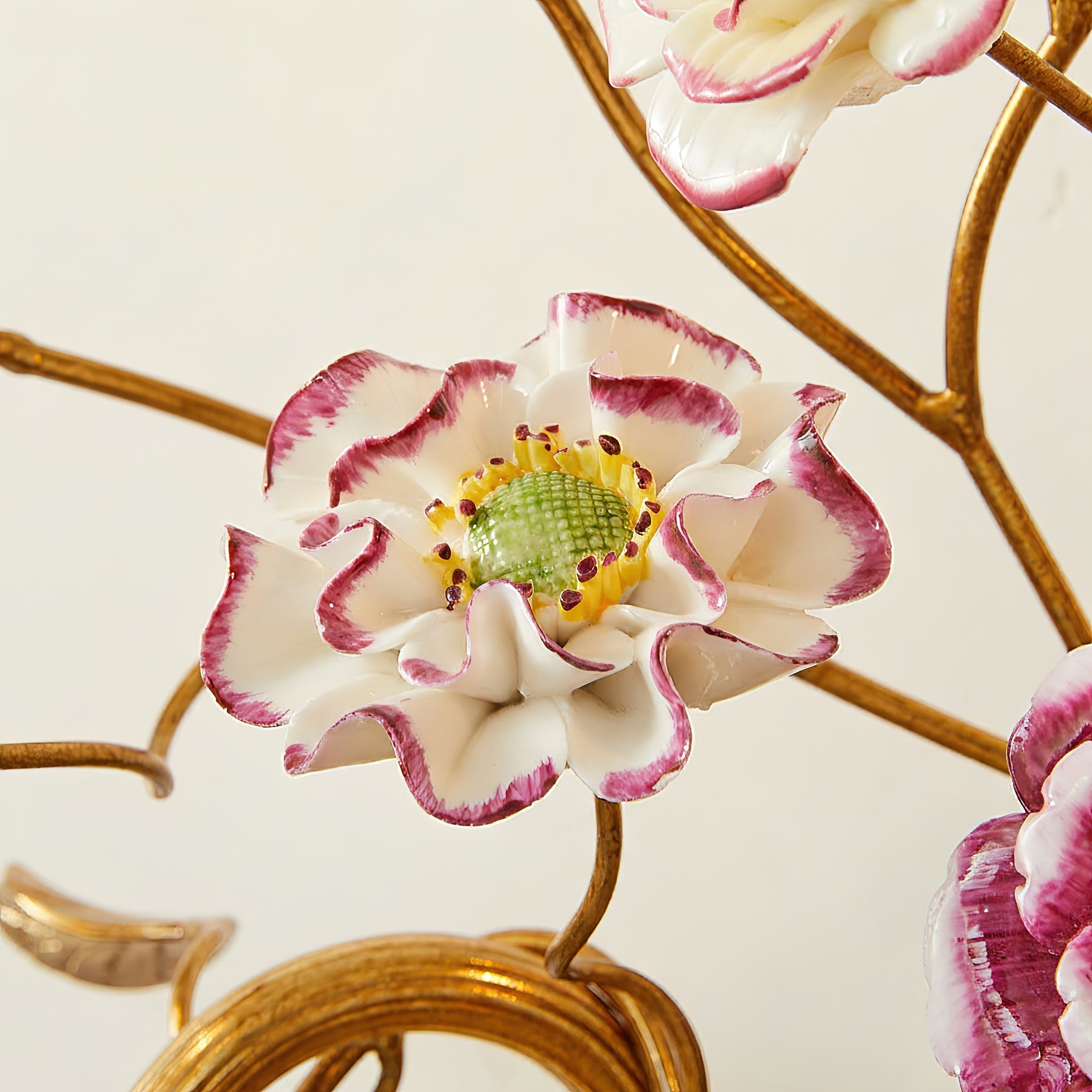 Full frontal view of the Tole Ceramic Flower Wall Lamp.