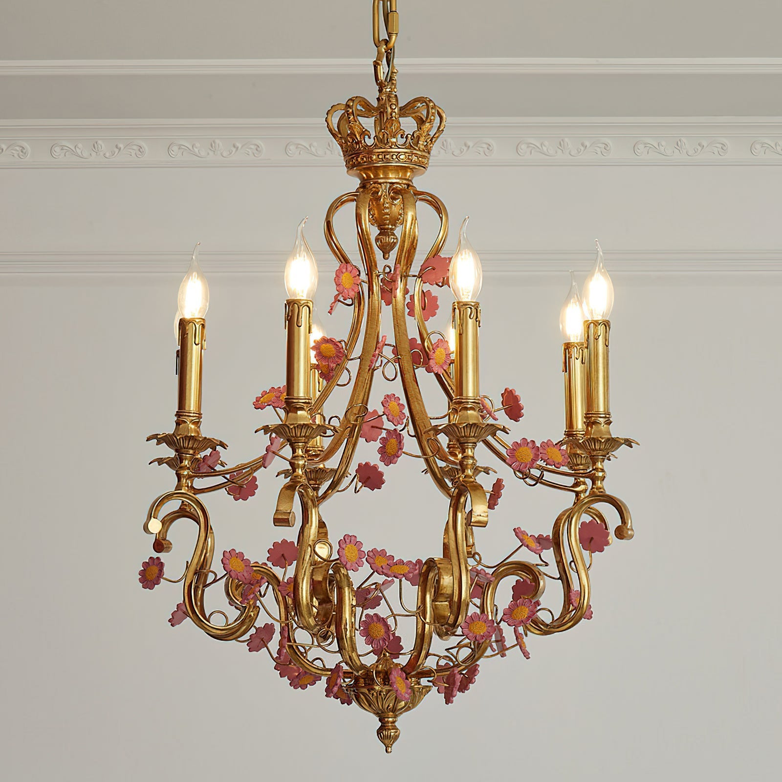 The chandelier shown in a primary entry foyer with a high ceiling.
