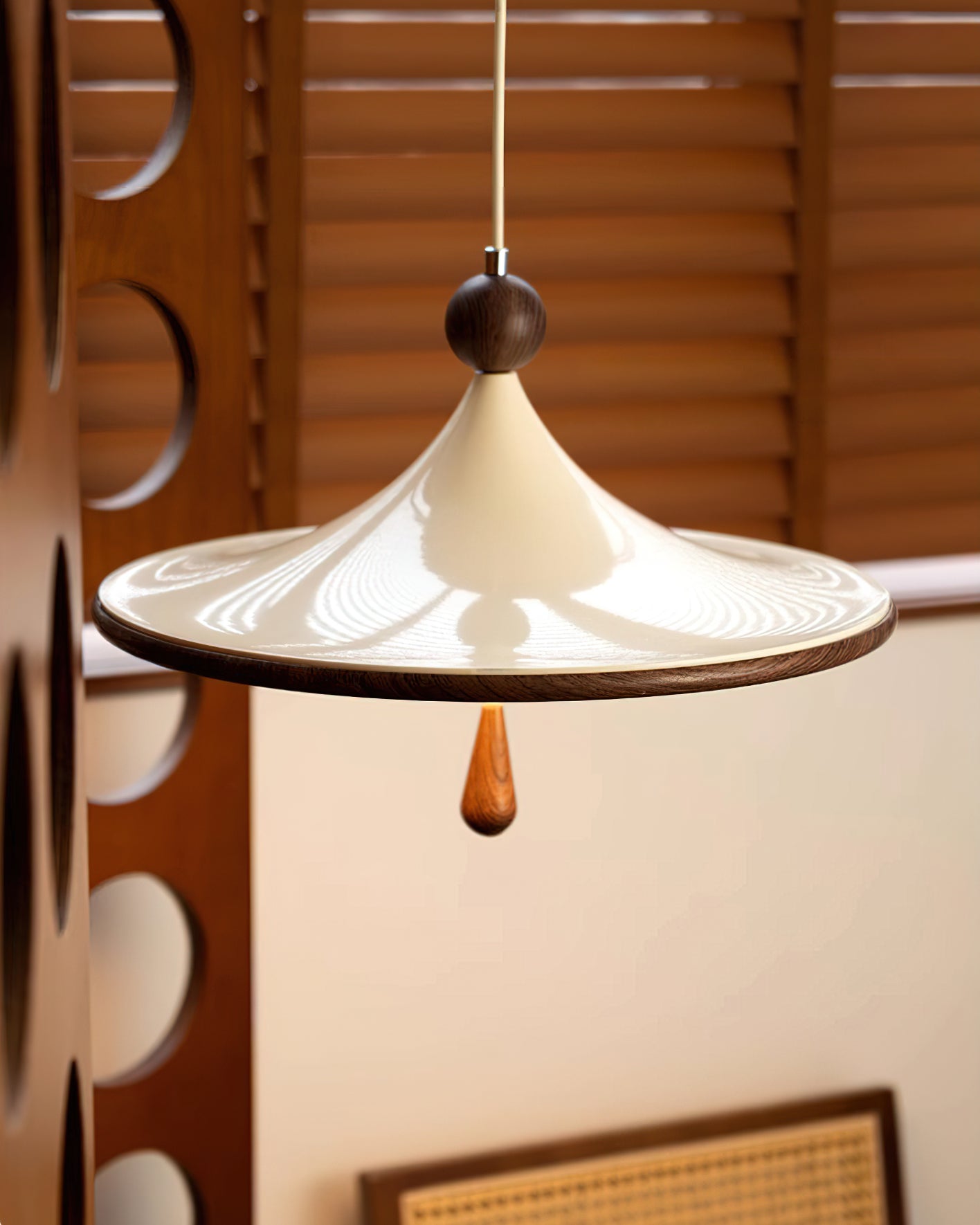 Lifestyle view of the Tomaso Pendant Light in a minimalist living room.