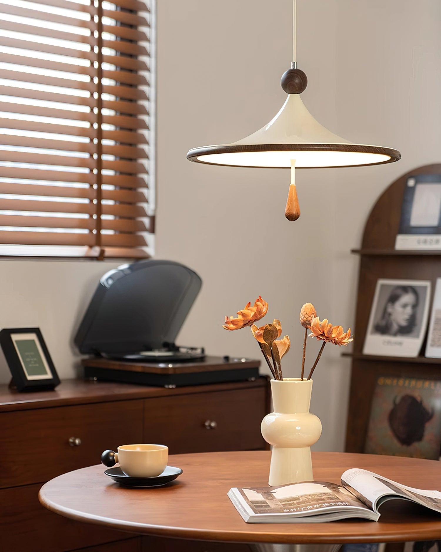 Close-up view of the walnut-colored accent on the Tomaso Pendant Light.