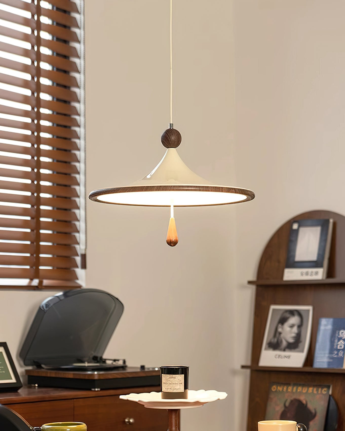 The Tomaso Pendant Light illuminated, casting a warm and inviting glow.