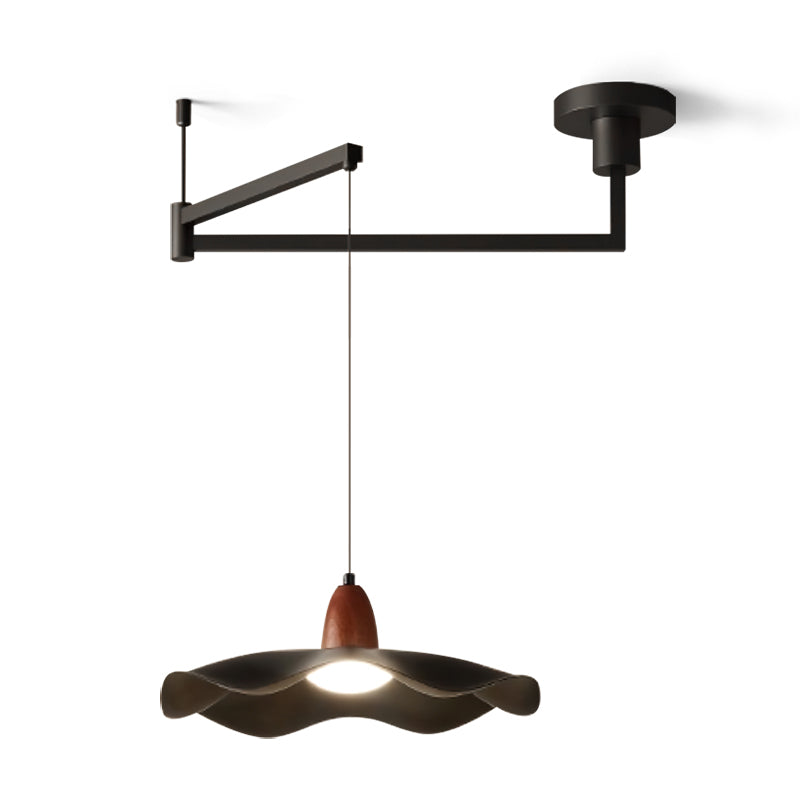 The pendant light against a neutral wall, highlighting its design.