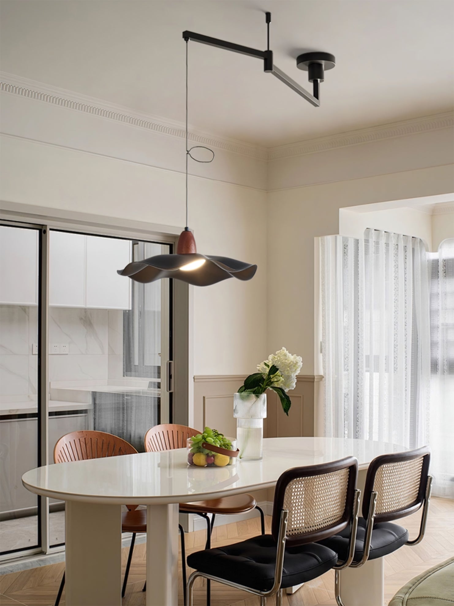 Pendant light shown in a modern dining room setting over a table.
