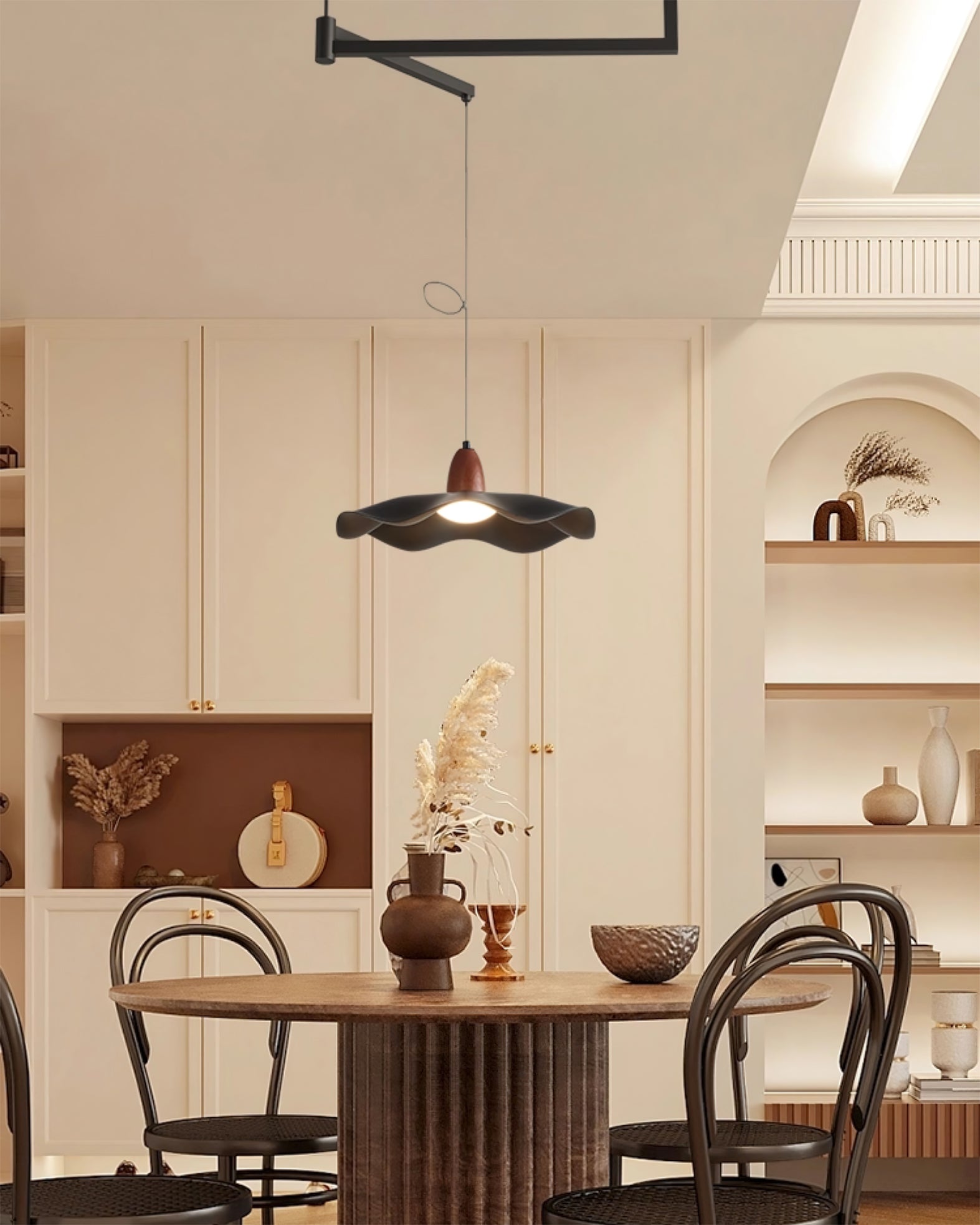 Swing arm pendant light illuminating a home office workspace.