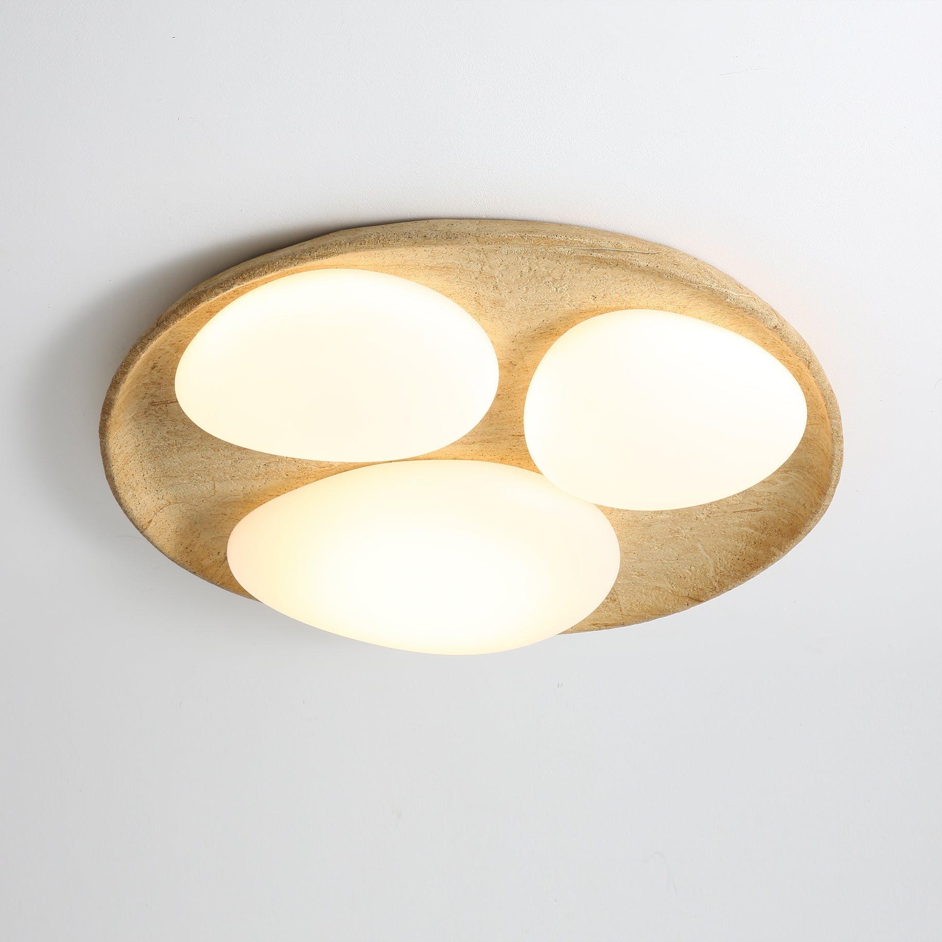 The beige and white finish of the Topo Ceiling Light.