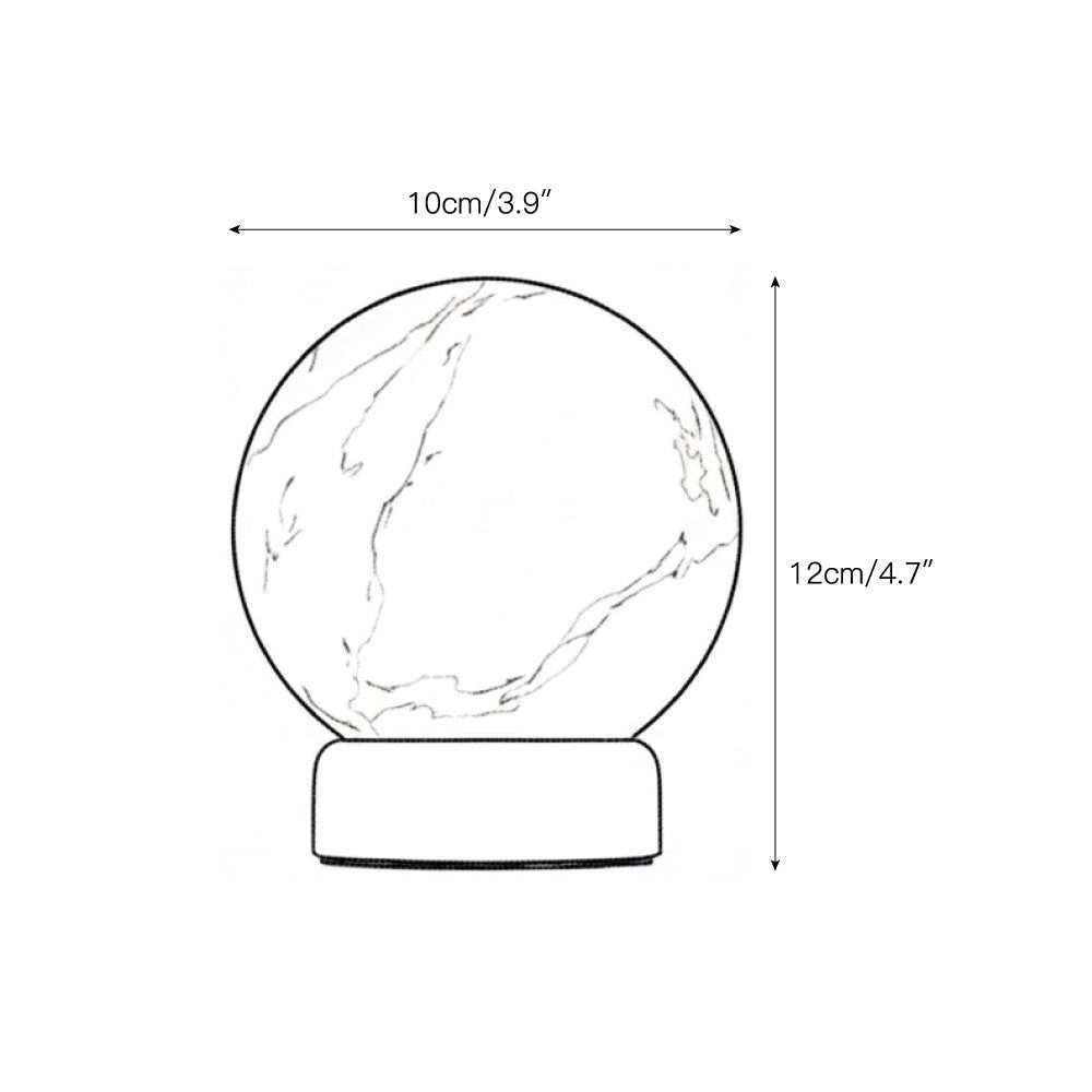 The Trevi Table Lamp illuminated, casting a warm glow.
