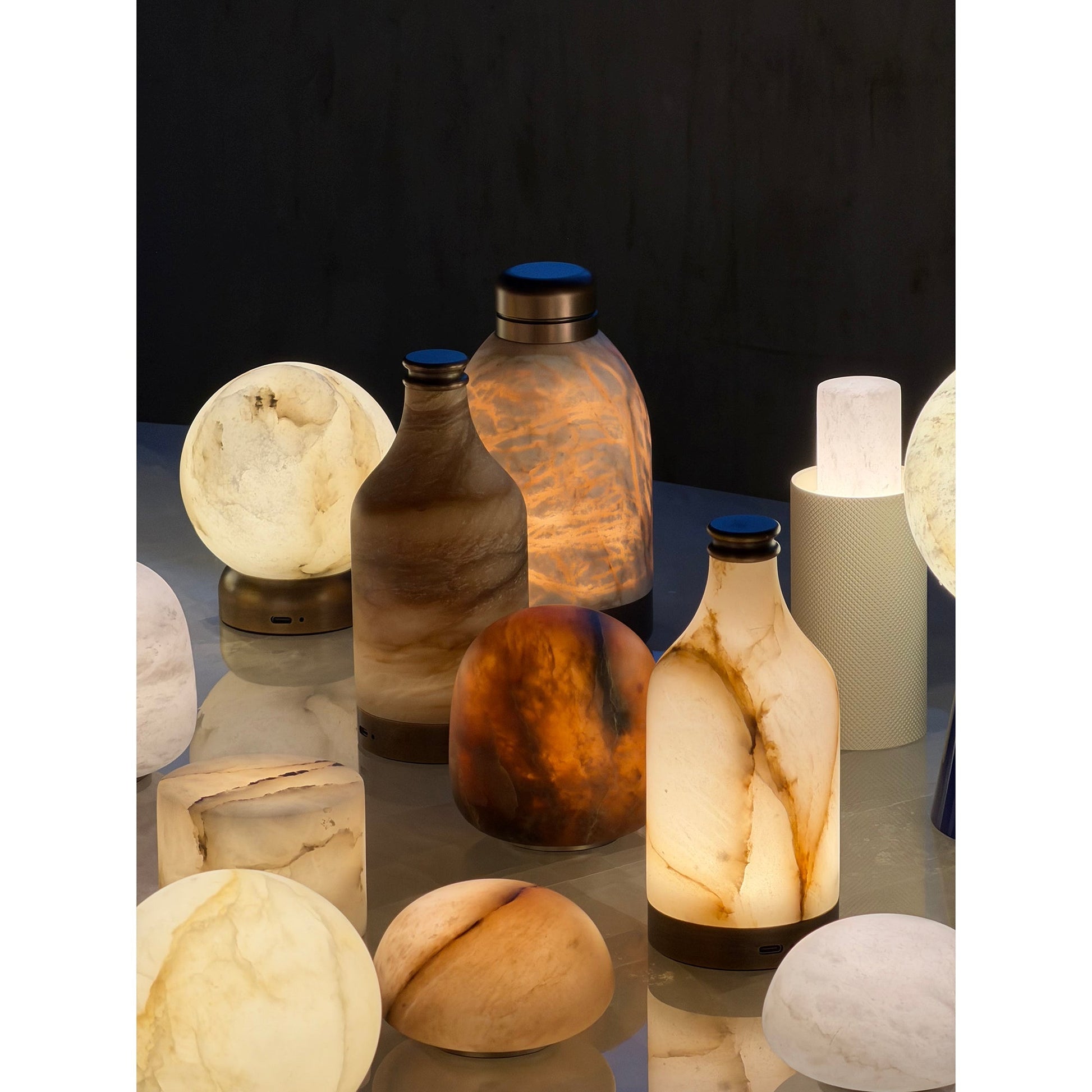 Lifestyle image of the Trevi Table Lamp on a bookshelf.
