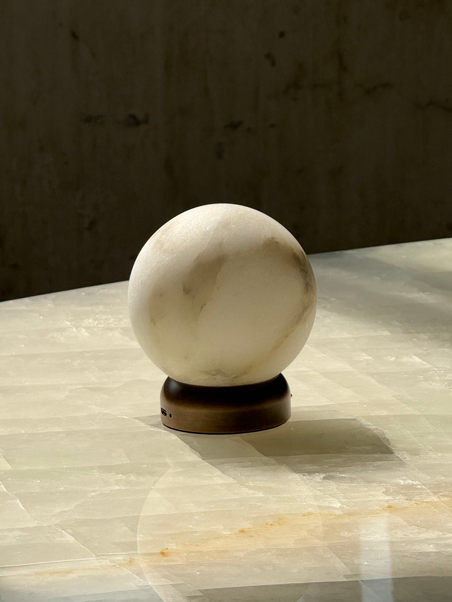 The Trevi Table Lamp shown with its included USB charging cable.