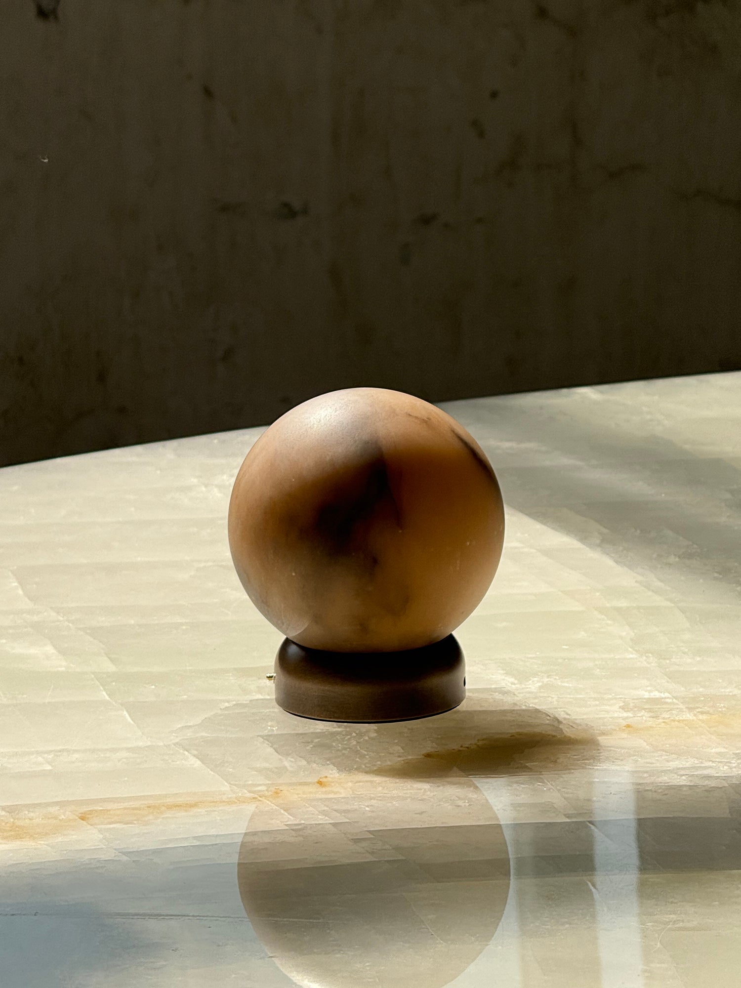 Trevi Table Lamp in a living room setting, providing ambient light.