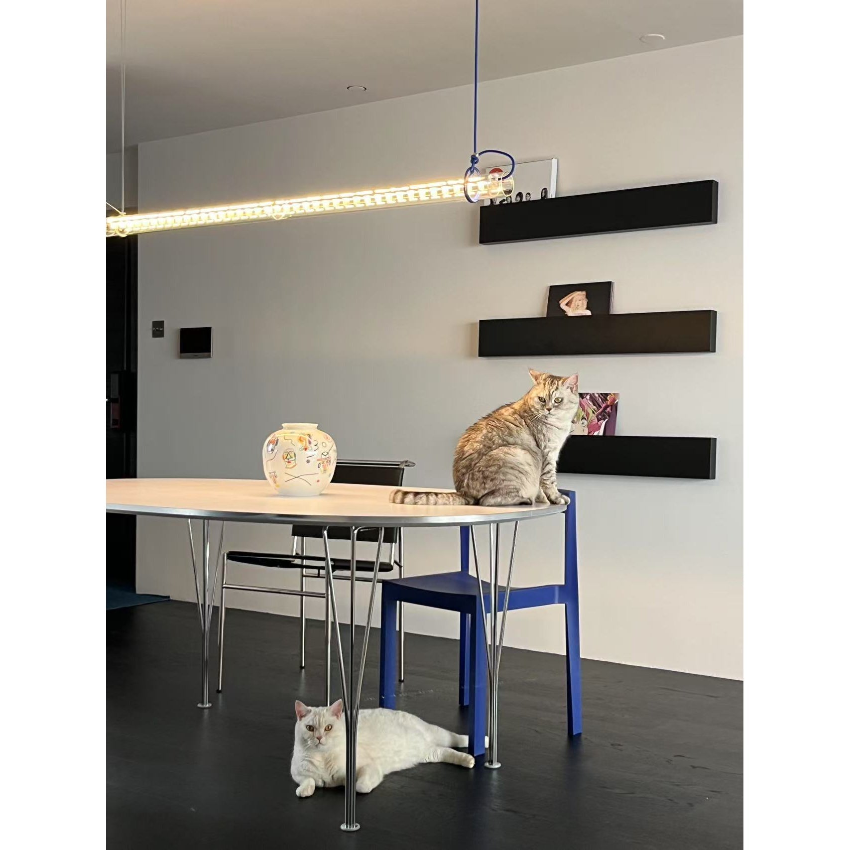 The warm glow emitted from the tubular LED lamp in a darkened room.