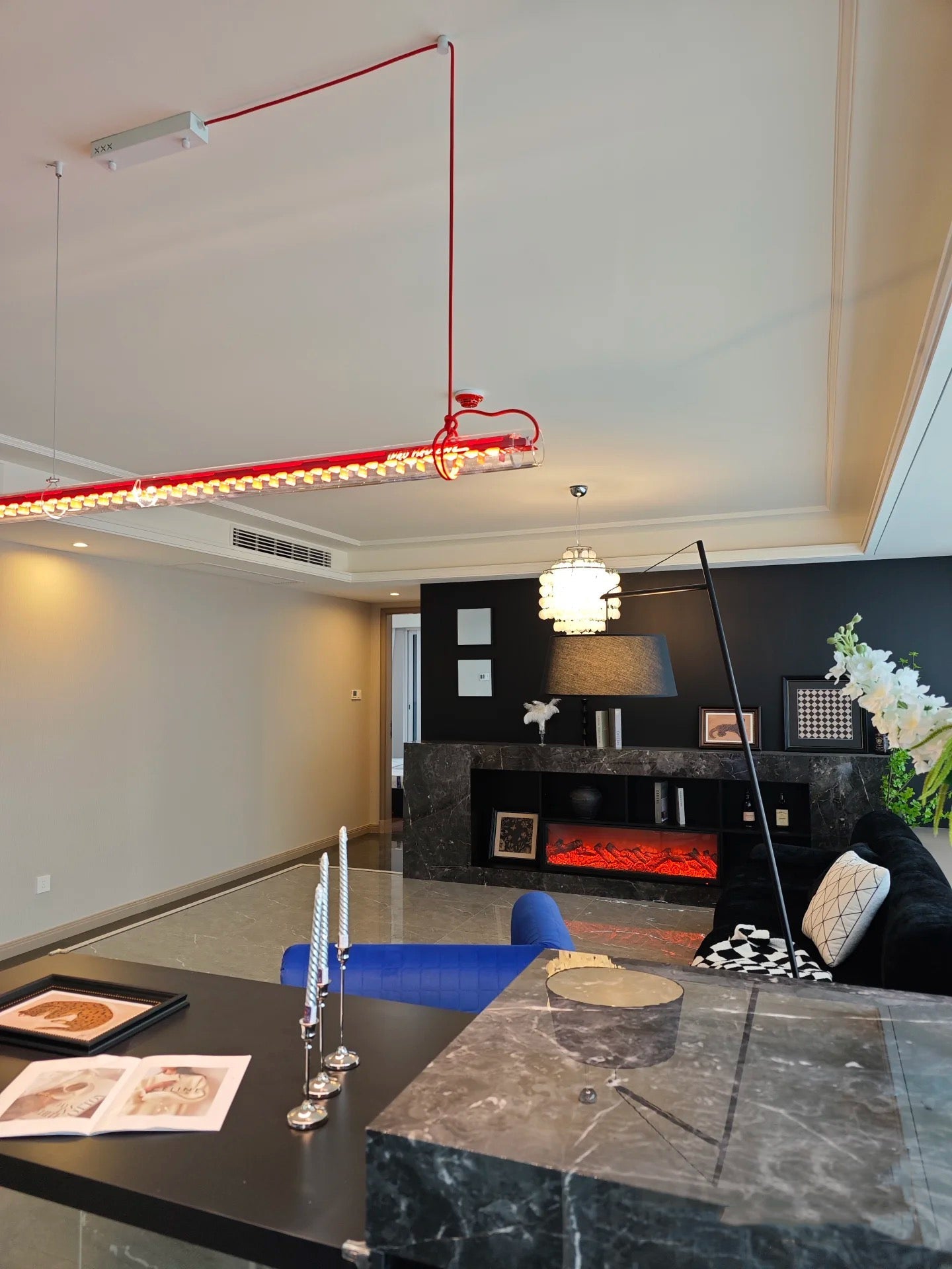 The pendant lamp turned off, showcasing the glass and iron details.