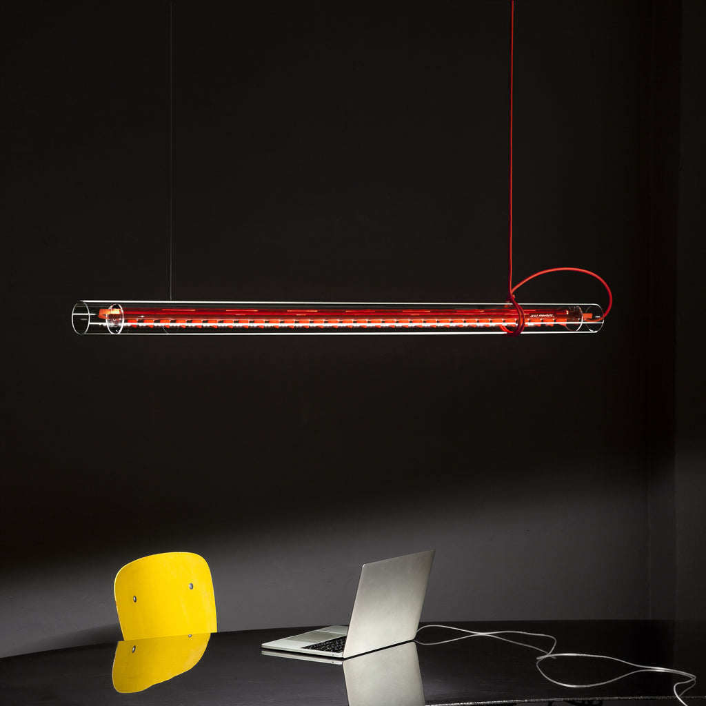 Close-up of the fire-polished end of the clear tubular lamp.