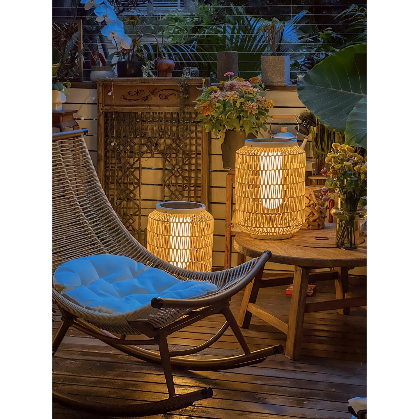 The warm light of the Tulum Lantern reflecting on a surface.
