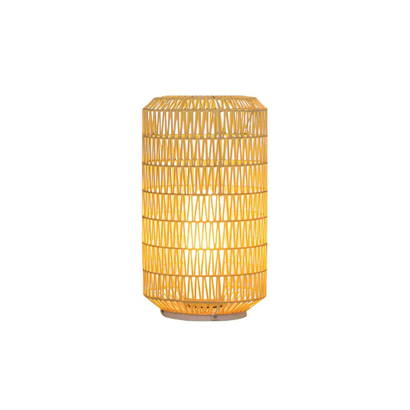 White Tulum Lantern glowing softly against a dark background.