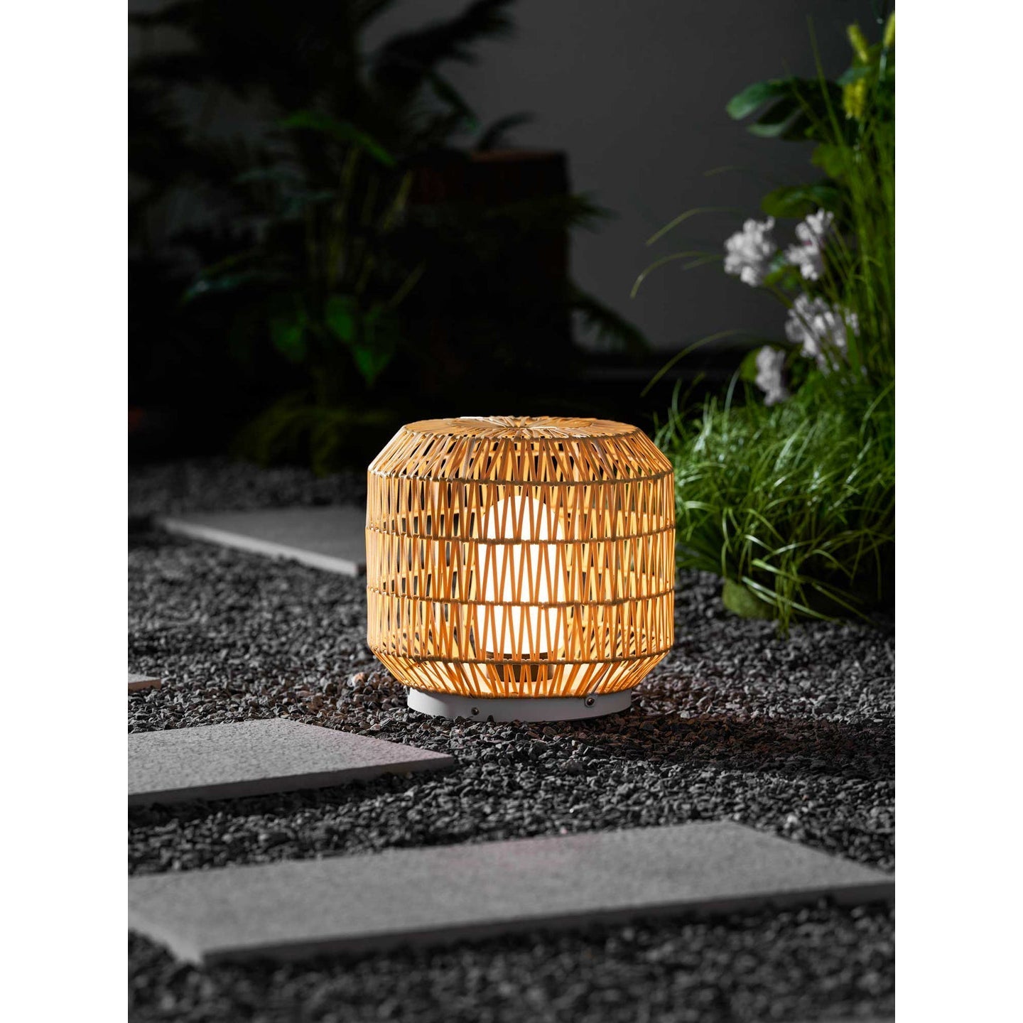 Tulum Lantern illuminating a cozy outdoor nook.
