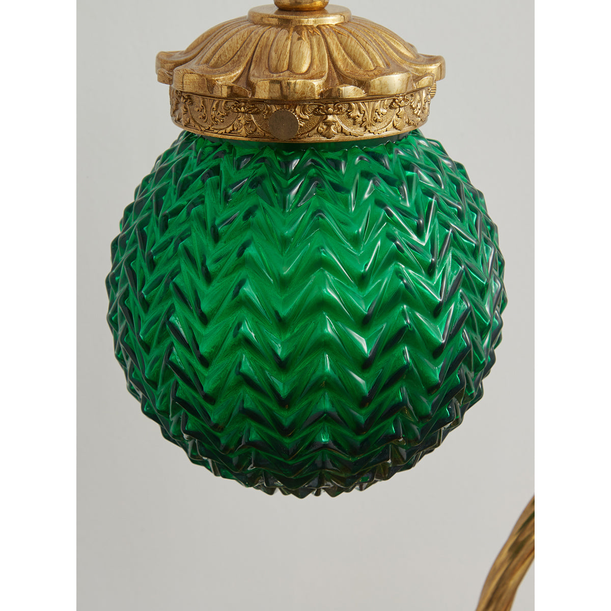 Turco Table Lamp in a dimly lit room to show its lighting effect.
