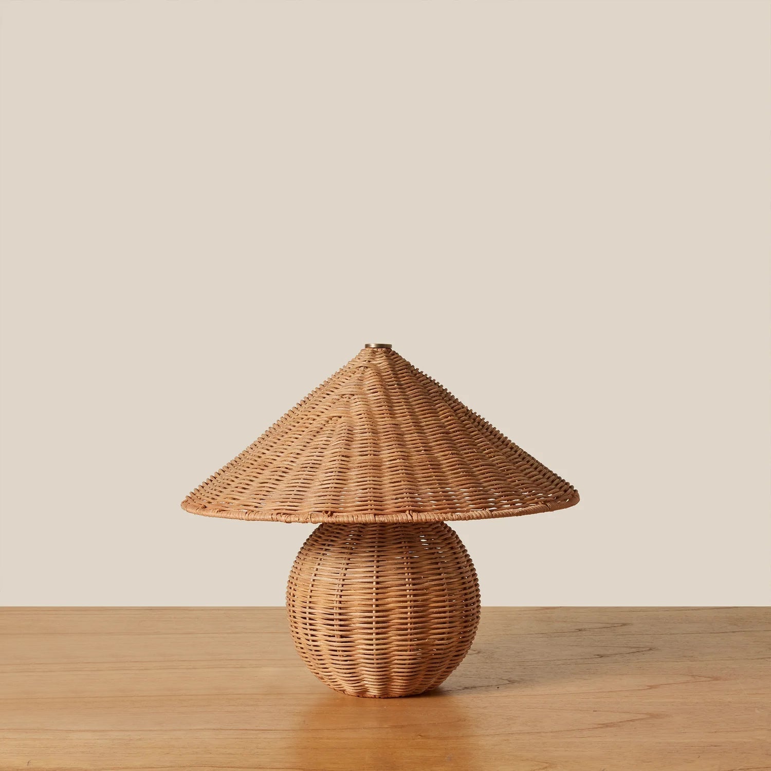 Close-up of the natural rattan weave on the Bobine Table Lamp shade.