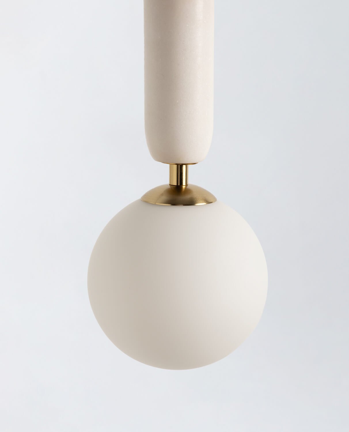 The Valenes Wall Lamp providing ambient light in a living room.