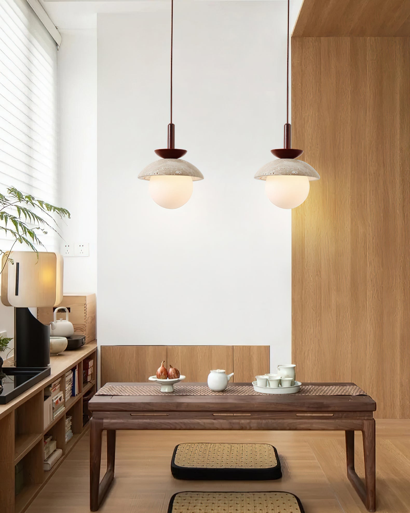 The 2-light linear Valerie Pendant Light over a dining table.