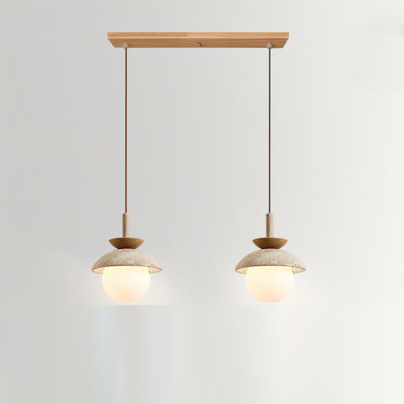 Valerie Pendant Light with a beige and walnut finish against a neutral wall.
