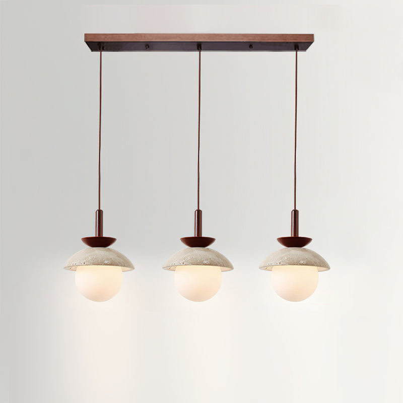 A pair of Valerie Pendant Lights used as bedside lighting.