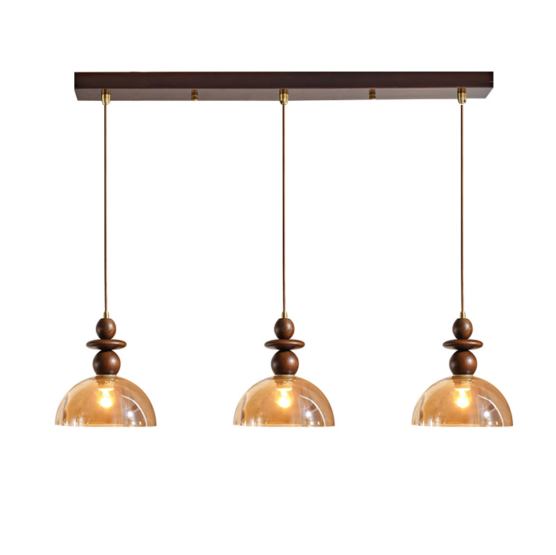 The Valeska Pendant Light turned on, showcasing the warm glow it produces.