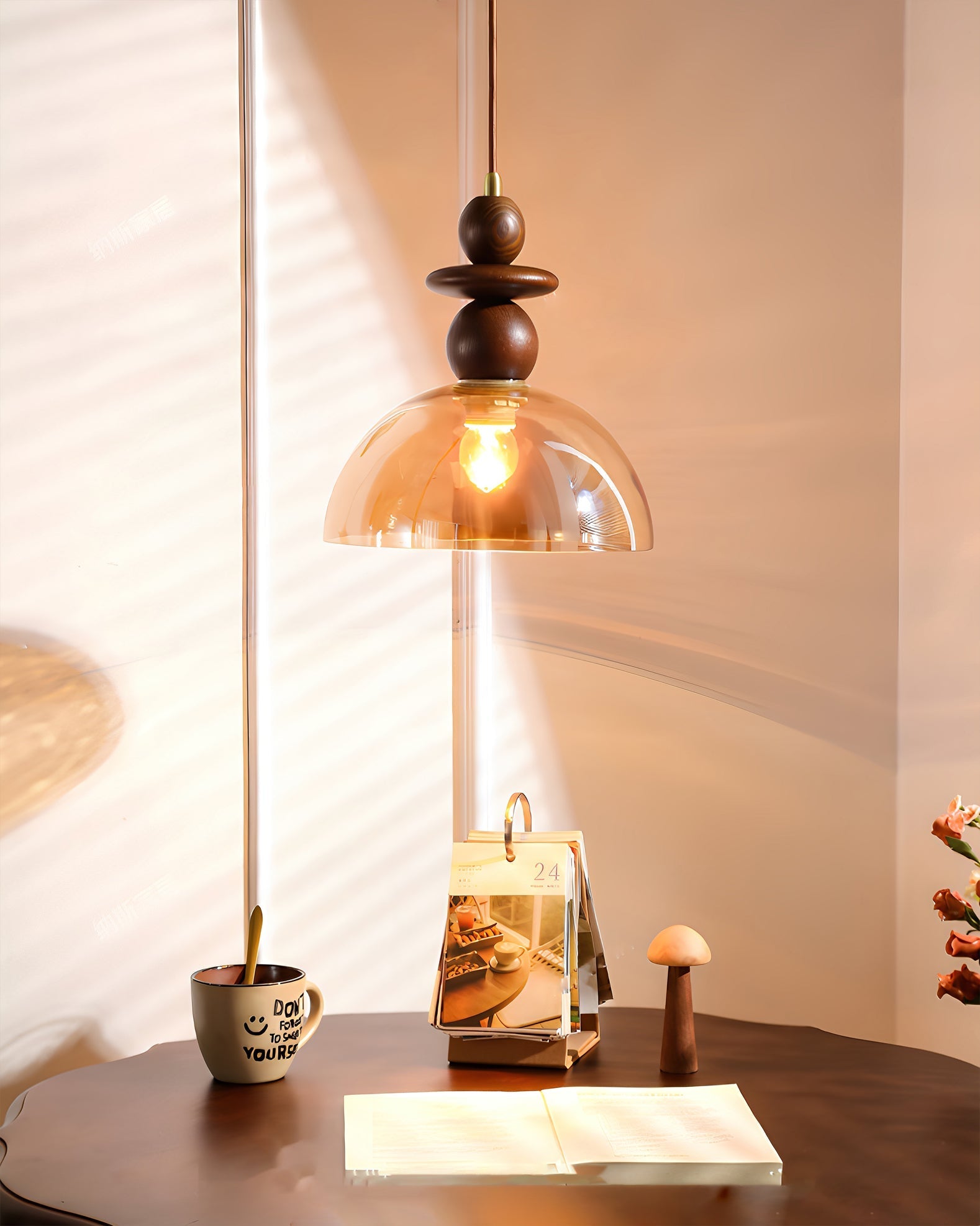 Detail shot of the light bulb inside the amber glass shade.
