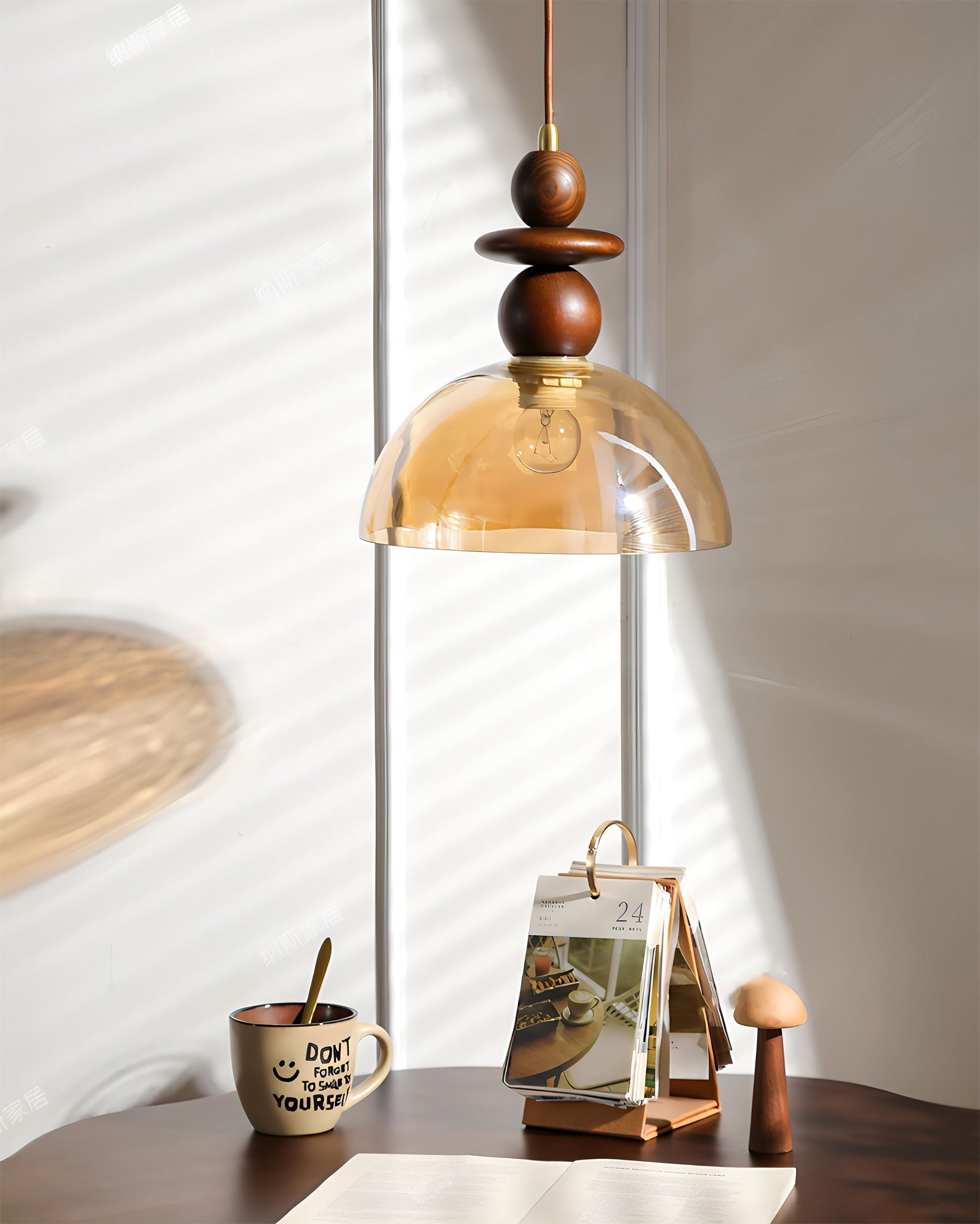 The 3-light Valeska Pendant Light suspended over a long wooden dining table.